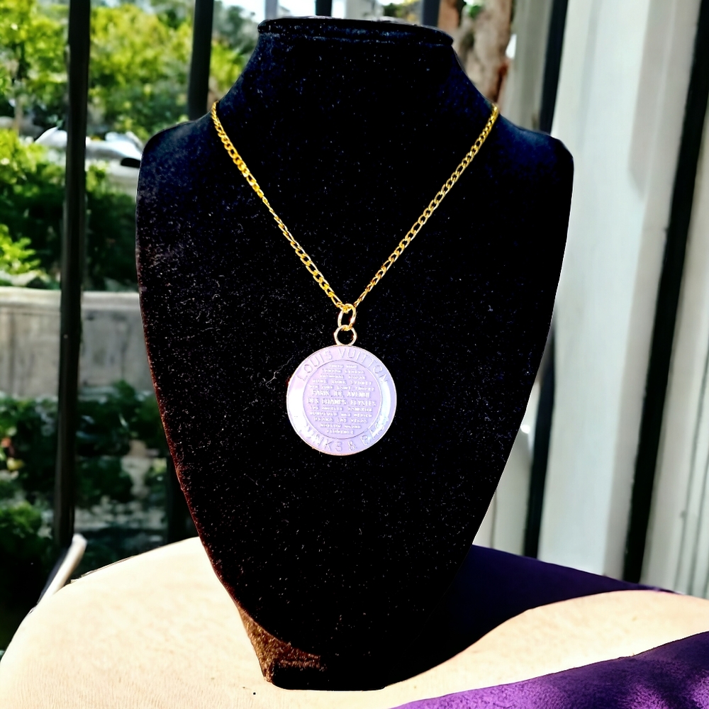 Round charm- upcycled- reworked on a stainless steel gold plated necklace.